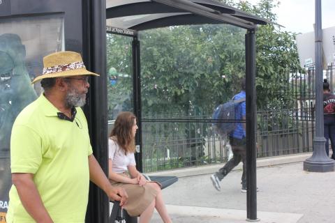 "Arsenal of Inclusion": this bus stop, on St. Paul St. outside Penn Station, serves both public and private buses. On the Charles St. side (above), the MTA and Circulator stops are separated from the Johns Hopkins Shuttle. Credit: Lawrence Lanahan.